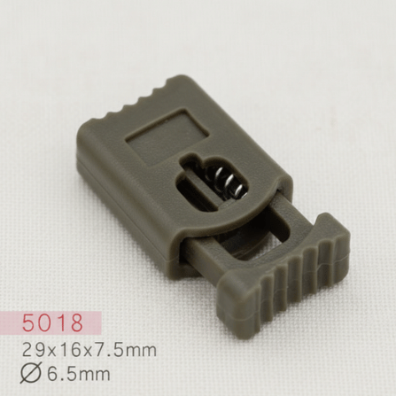 Baycar 5018 Dokulu Yassı Haki Stoper, 29 × 16 × 7,5 mm, Ø 6,5 mm kordon geçişi